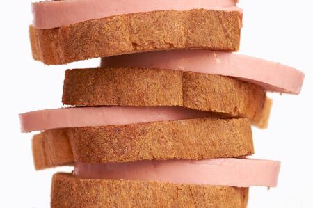 The cut bread and sausage on white background isolatedの写真素材