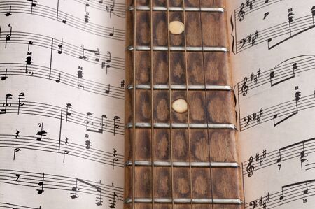 Old guitar and musical notesの写真素材