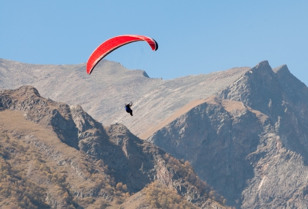 Paragliding flight in the mountains Caucasus Russiaの写真素材