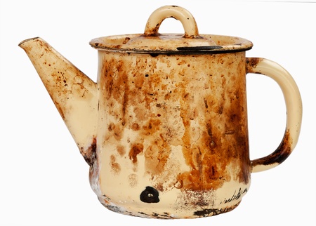 Old sooty kettle on white isolatedの写真素材