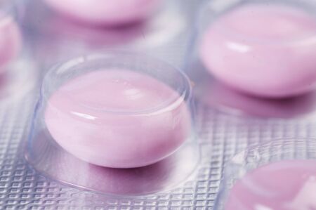 Pink tablets in packageの写真素材