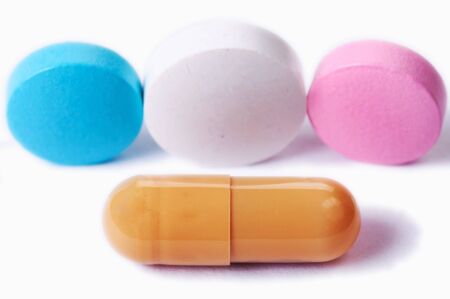 Capsule and pills on white macroの写真素材