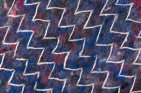 Colorful wool texture with white ornament