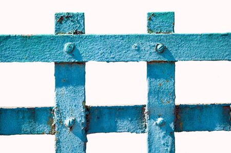 Old metal fence painted in blue on white isolated