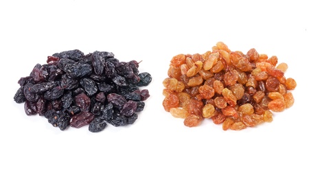 Light and dark raisins on white with shadowの写真素材