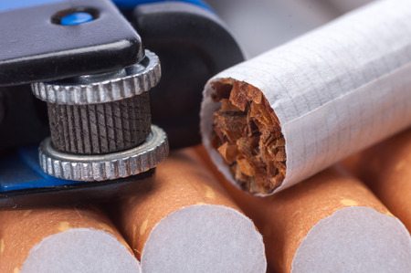 Tobacco in cigarettes and lighter close upの写真素材