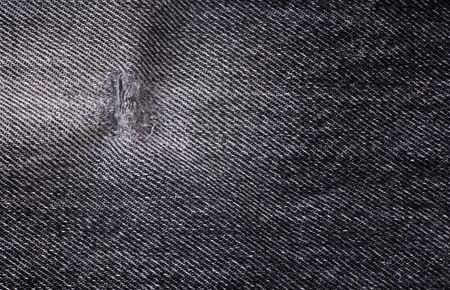 Little hole in ripped back jeansの写真素材
