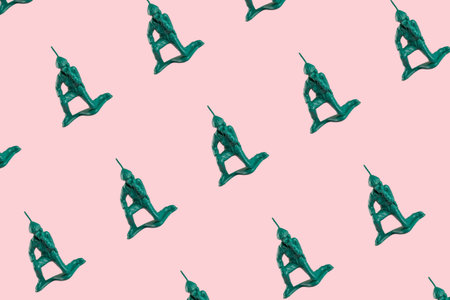 pattern of plastic toy comunication soldier on a pop vibrant pink background
