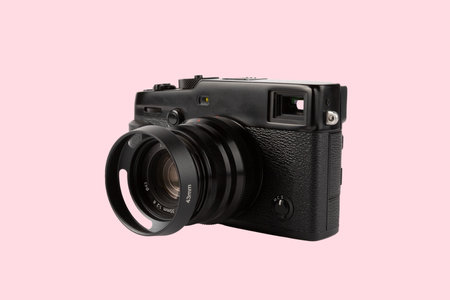 Telemetric digital photo camera isolated on pink background.の写真素材