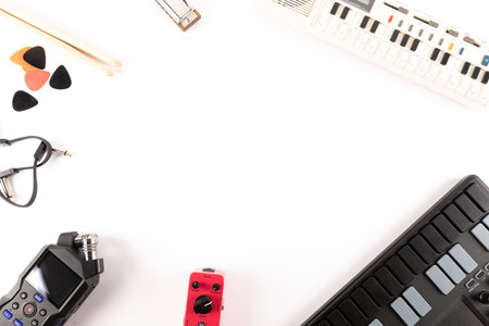 Music production equipment top view white background with copy spaceの写真素材