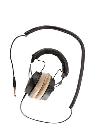 Studio headphones with spiral cable isolated on white background