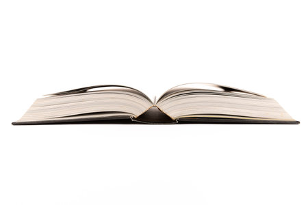 Open book laying flat isolated on white background
