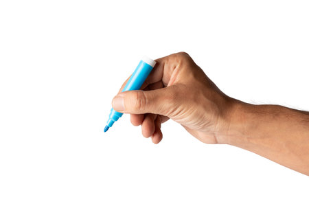 Male hand holding a blue felt tip isolated on white backgroundの写真素材