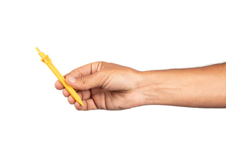 Male hand holding an irrigation dripper isolated no background cutoutの写真素材