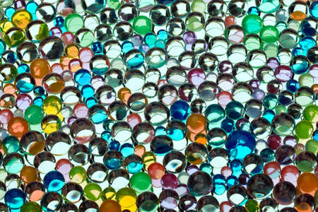 Varicoloured beautiful marbles on a white backgroundの写真素材