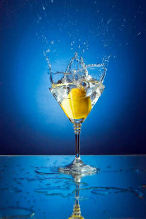 Lemon in beautiful glass with waterの写真素材