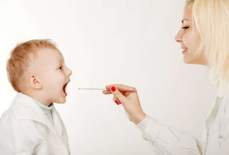 The little boy on reception at the pediatristの写真素材