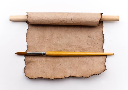 old paper sheet with paintbrush.の写真素材