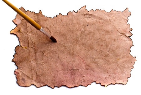 old paper sheet with paintbrush.の写真素材