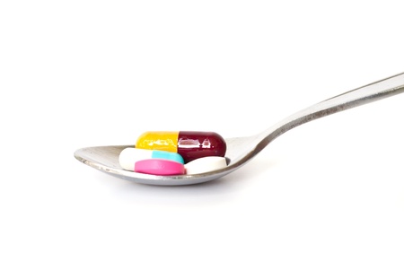 medical  pills  on  a spoon .