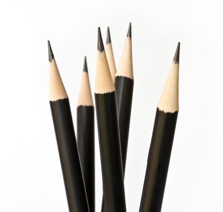 close-up of black pencil isolated on white background の写真素材
