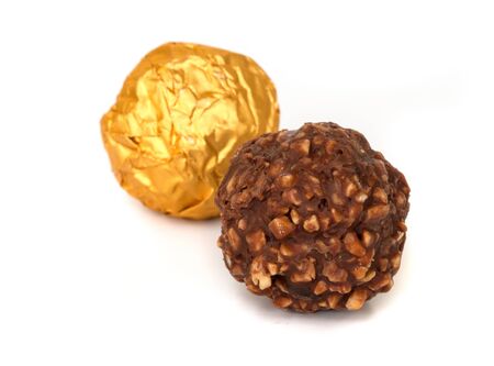 Chocolate balls with almond  in a gold foil paper.の写真素材