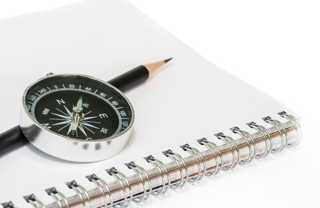 Compass with the book  on white background.の写真素材