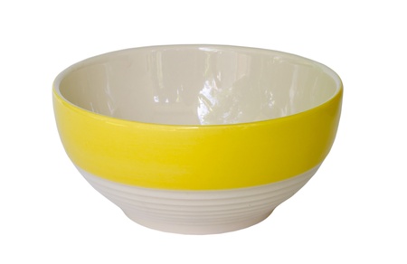 yellow ceramic bowl on white background.の写真素材