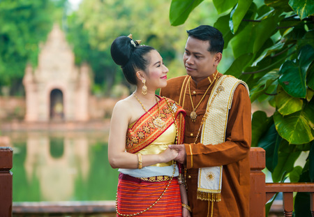 Portrait of man and woman in  traditional clothes of the north of Thailandの写真素材