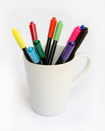 colorful marker pens on a white glass.の写真素材