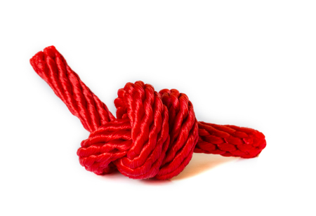 Red rope with a knot isolated on white Background .の写真素材