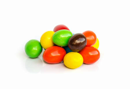 Close up of colorful chocolate coated candy .