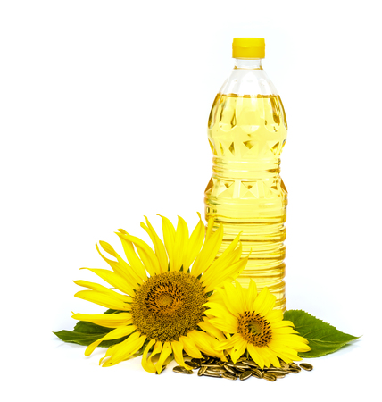 Bottle of sunflower oil with sunflower isolated on white background.の写真素材
