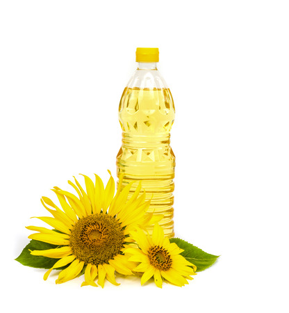 Bottle of sunflower oil with sunflower isolated on white background.の写真素材