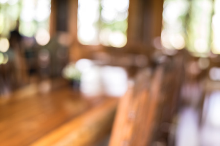 blured Wooden tables and chairs  in a coffee shop.の写真素材