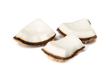 Piece of coconut close up on a white background.