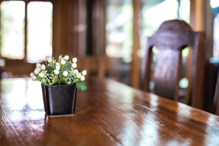 Wooden tables and chairs in a coffee shop.