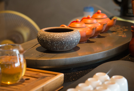 Close up of  tea pot and cups on  table.の写真素材