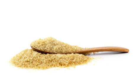 brown sugar cane with wooden spoon on white background.の写真素材