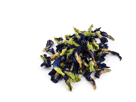 Close up of Dry Butterfly pea flower on white background.の写真素材