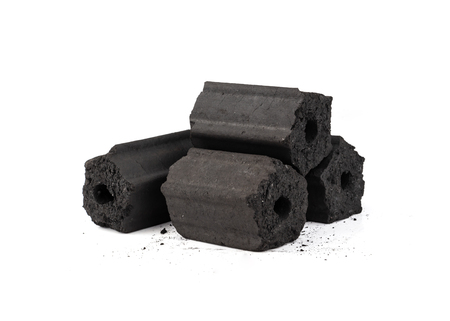Pile of natural wood charcoal isolated on white background.の写真素材