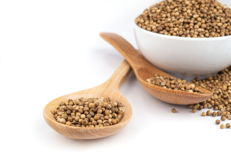 Pile of coriander seeds isolated on white background .の写真素材