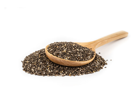 Healthy Chia seeds in a wooden spoon isolated on white.の写真素材