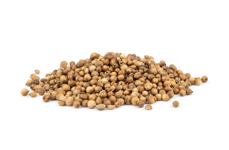 Pile of coriander seeds isolated on white background .の写真素材