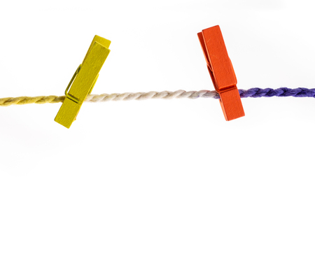 colorful wooden clothes pin isolated on white.の写真素材