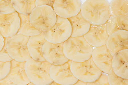 Top view of dried banana slices in natural light.の写真素材