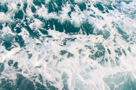 Ocean Water and Waves with a trails from a ferryboat