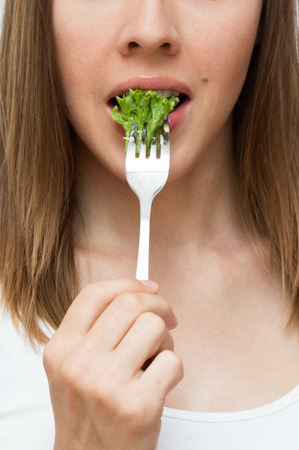 Woman eating healthy food conceptの写真素材