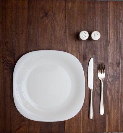 Dinner table with dinning plate, fork and knife.の写真素材