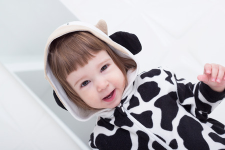 Baby in cow costumeの写真素材
